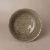 A Chinese Yaozhou celadon 'peony' bowl, Northern Song dynasty 北宋 耀州窯青釉刻花牡丹紋盌 | Santos Collection