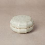 A Chinese Qingbai 'floral lattice' box and cover, Southern Song dynasty 南宋 青白釉花卉紋蓋盒