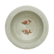 A Chinese Longquan biscuit-decorated celadon-glazed 'twin fish' bowl, Yuan dynasty 元 龍泉窰青釉露胎貼雙魚紋折沿盤