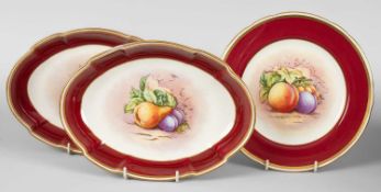 Two Royal Worcester oval dessert dishes and a plate painted with fruit