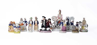 A collection of Staffordshire pottery figures