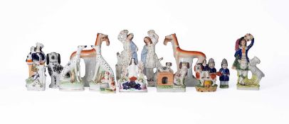 A collection of Staffordshire pottery figures and models of animals