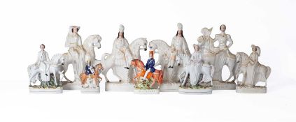 A collection of Staffordshire pottery equestrian figures