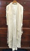 A 1920s silk wedding dress with lace shawl, 1470mm collar to hem