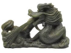 A Chinese carved green soapstone flaming dragon fi