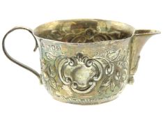 An 1899 Victorian London silver cream jug with dec