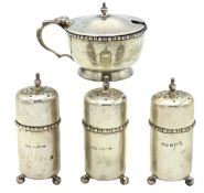 A four piece condiment set of matching design, thr