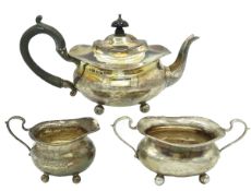 A 1913 Birmingham silver small three piece tea set
