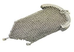 A continental silver mesh purse, lacking one decor