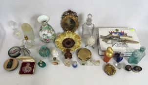 A collection of various scent bottles, a small rep