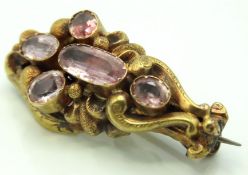 A Victorian yellow metal brooch set with white sto