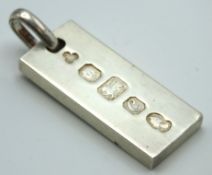 A 1977 London hallmarked silver ingot, 51mm drop,