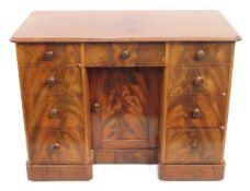 A mid 19thC. Victorian satin birch knee hole desk