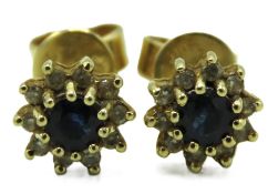 A pair of 14ct gold earrings set with sapphire & s