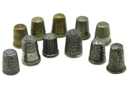 A collection of six silver & white metal thimbles