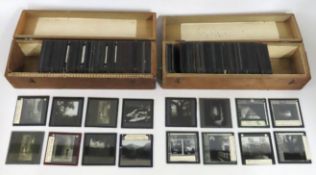 Two boxes of antique glass slides, one being Wales
