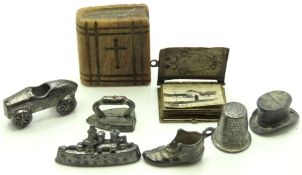 Six vintage Monopoly game tokens, a metal bound mi