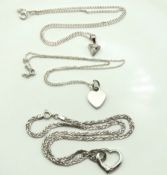 Three silver chains with silver & white metal pendant, total weight 15.9g