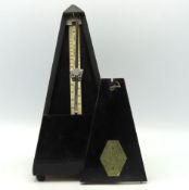 A Maezel Swiss metronome, 250mm tall