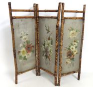 An early 20thC. bamboo & tin fire screen, 845mm wi