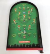 A football bagatelle game with box, lacking ball,