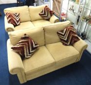A modern two seater sofa with matching two seater