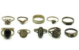 Ten silver & white metal rings, one set with sapph