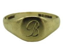 A 9ct gold signet ring monogrammed 