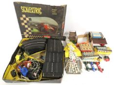 A vintage 1960s Scalextric model game with three c