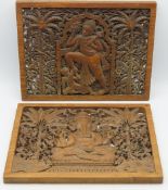 A pair of Indonesian carved teak panels depicting