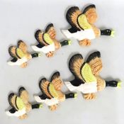 Two matching graduated plaster flying duck wall pl