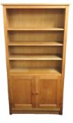 A modern oak bookcase with cupboard under, 1720mm