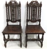 A pair of 19thC. Gothic style oak hall chairs, 108