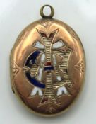 A yellow metal Victorian locket with losses to ena