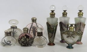 A small selection of scent bottles, one with silve
