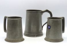 Three pewter tankards, 