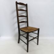 An English Aesthetic Movement ladderback chair wit