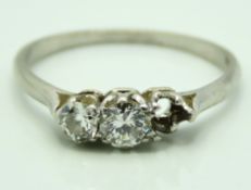 An antique platinum ring set with two old cut diam