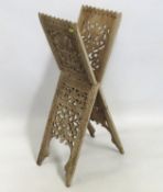 An antique carved teak Anglo-Indian Qur'an stand,