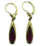 A pair of 14ct gold earrings set with amethyst, 37