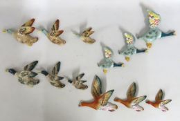 Four sets of graduated flying duck wall plaques, l