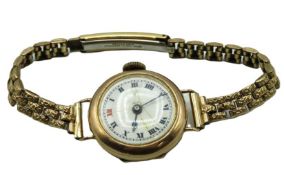 A 9ct gold cased ladies wristwatch with rolled gol
