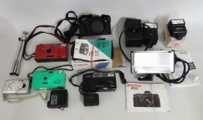 A Pentax P30 with a 24-50mm Sigma lens, a Canon Su