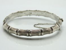 A 1970s Birmingham silver bangle with bamboo style