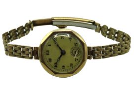 A 9ct gold cased wristwatch with rolled gold strap