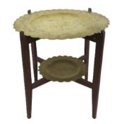 An early 20thC. two tier brass topped Benares styl