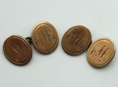 A pair of yellow metal cufflinks, monogrammed 