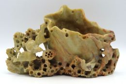 A Chinese carved soapstone spill vase with bat dec