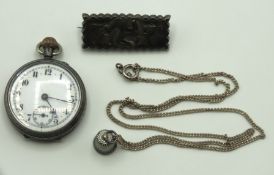 A silver brooch with Isle of Man emblem, a silver