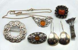 A silver Celtic brooch, 43mm diameter, a silver ne